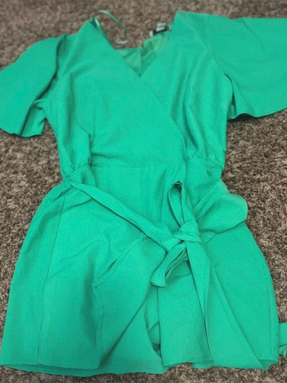 Chic Green Wrap Dress with Black Hat